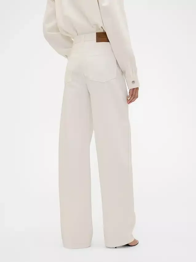 Džíny GAP × Victoria Beckham s vysokým pasem a obloukovým střihem