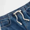 Džíny s volným střihem a středně vysokým pasem z pleteného denimu