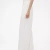 GAP × Victoria Beckham – kalhoty s vysokým pasem a plisovaným obloukem