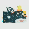 Měkká šustivá knižka „Little Rocket Finds Home“