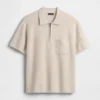 Oversized svetr s kapesním polo tričkem a čtvrtinovým zipem