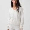 Oversized svetr s výstřihem do V z materiálu CashSoft
