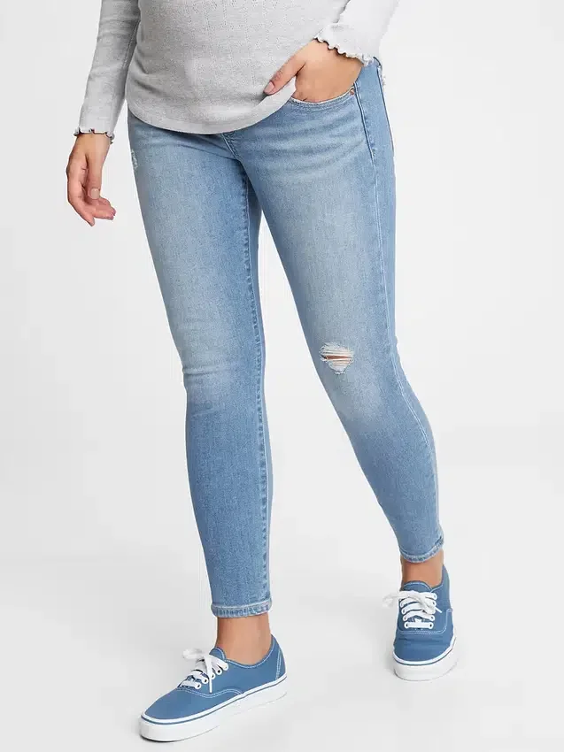 Těhotenské skinny džíny s nízkým pasem, celoplošným panelem a efektem opotřebení