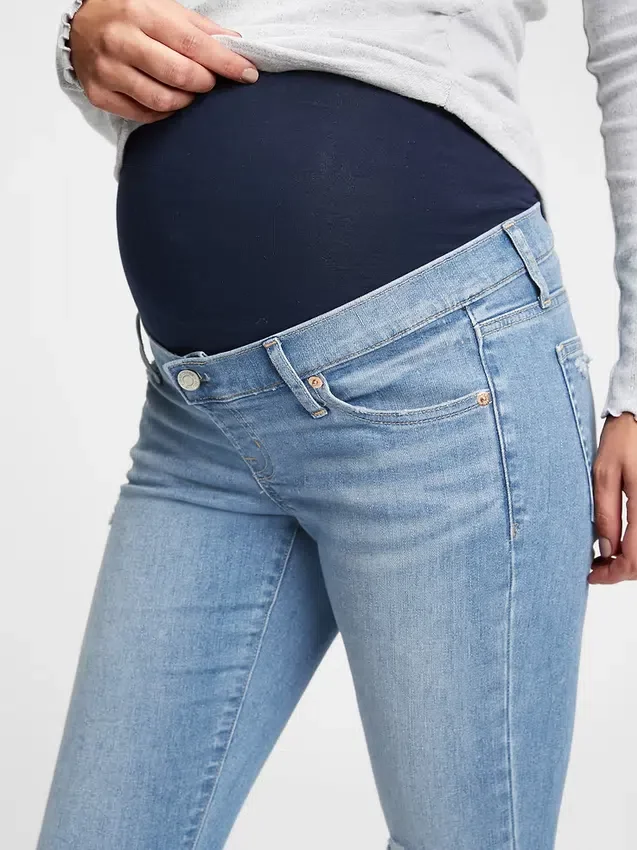 Těhotenské skinny džíny s nízkým pasem, celoplošným panelem a efektem opotřebení