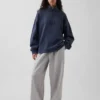 Těžký oversized pulovr s logem a čtvrtinovým zipem