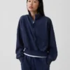Vintagesoft Oversized pulovr s polozipem a klínovým výstřihem