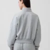 Vintagesoft Oversized pulovr s polozipem a klínovým výstřihem